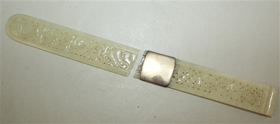 A Chinese pale celadon jade belt buckle section and a similar page turner, late 19th century, 28.5cm, broken with an old silver repair